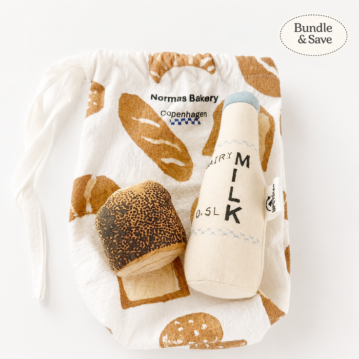 Toy bread and bottle with 'Norms Bakery Copenhagen' packaging on a white background