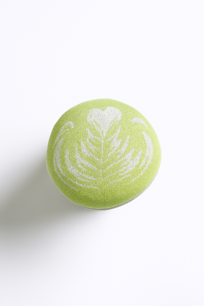 Handmade textile matcha latte play food detail with soft green cup top and white latte art, hand-printed and sewn in Denmark for pretend café play