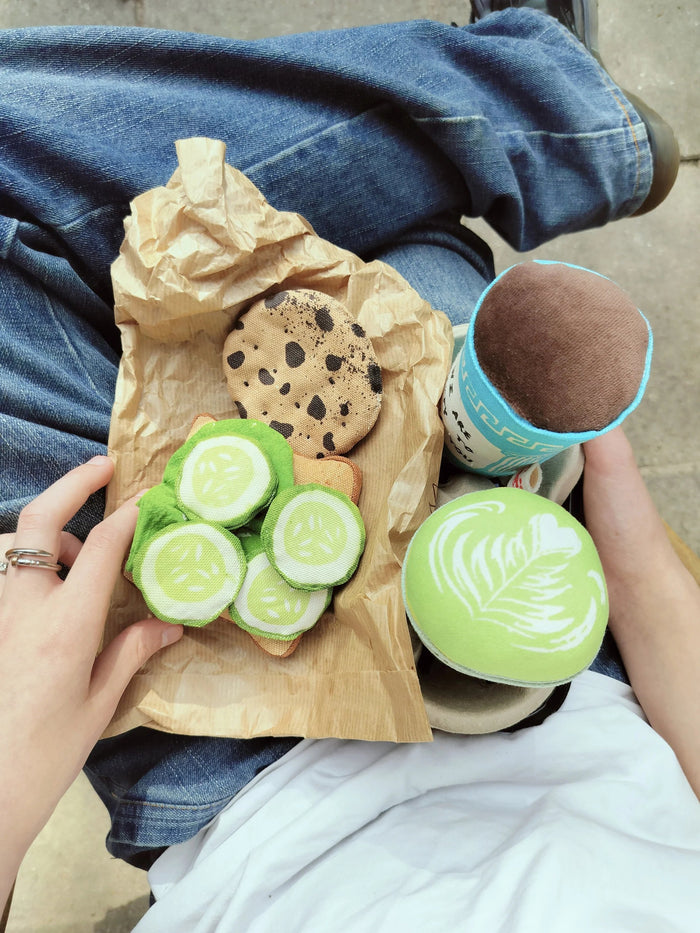 Handmade textile matcha latte play food with cucumber slices and cookie for pretend café play and play kitchens.