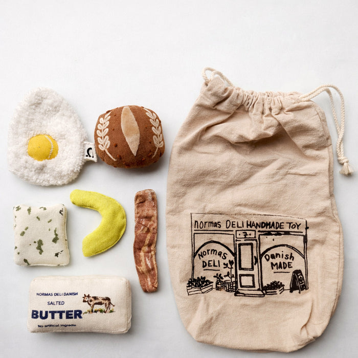 Handmade morning breakfast play food set with soft fabric fried egg, bread roll, cucumber, bacon, butter and cotton deli bag for pretend play kitchens.